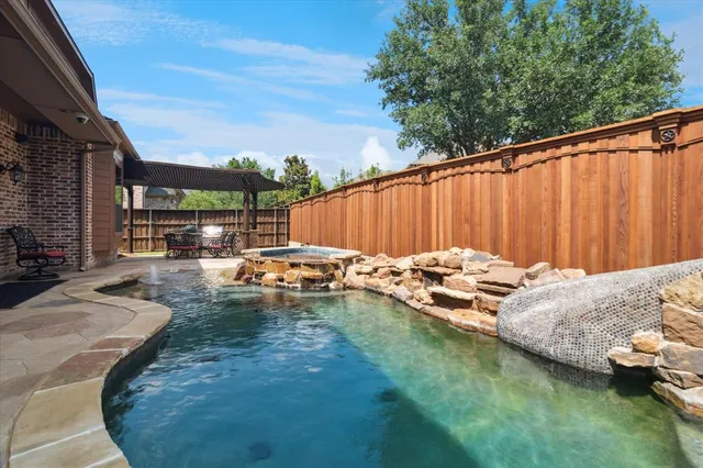 a view of swimming pool with a patio