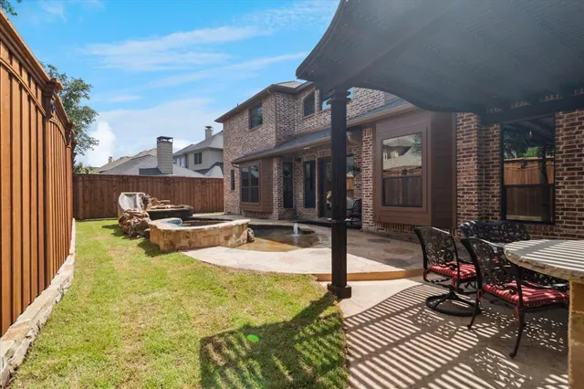 a view of a chairs and table in the patio