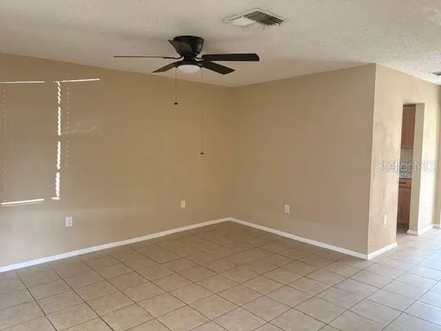 a kitchen with stainless steel appliances granite countertop a sink and a white cabinets