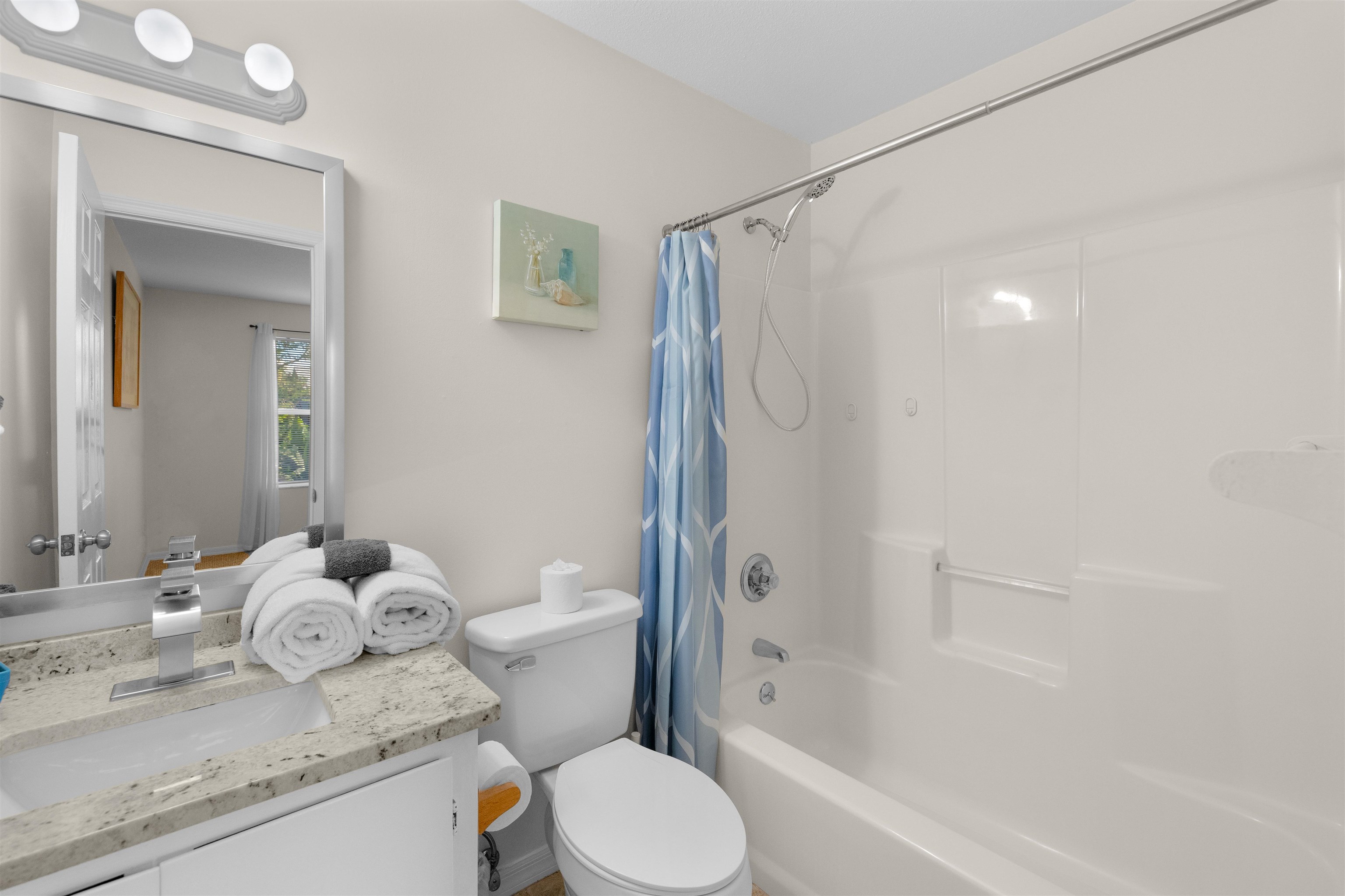 109 B Street, Unit D St. Augustine Beach, FL 32080 - Photo 16 of 29 a bathroom with a granite countertop sink toilet and shower