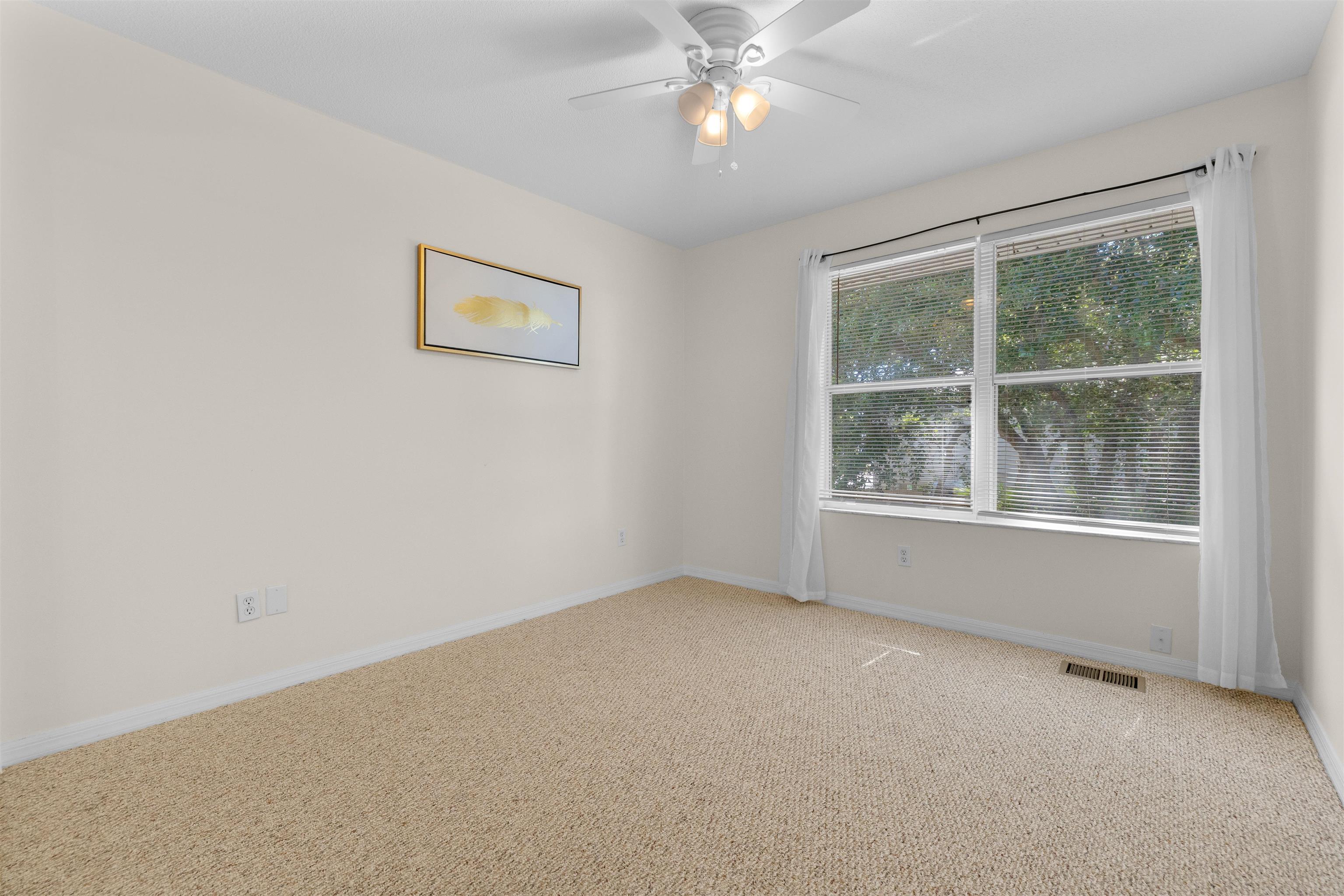 109 B Street, Unit D St. Augustine Beach, FL 32080 - Photo 17 of 29 an empty room with a window