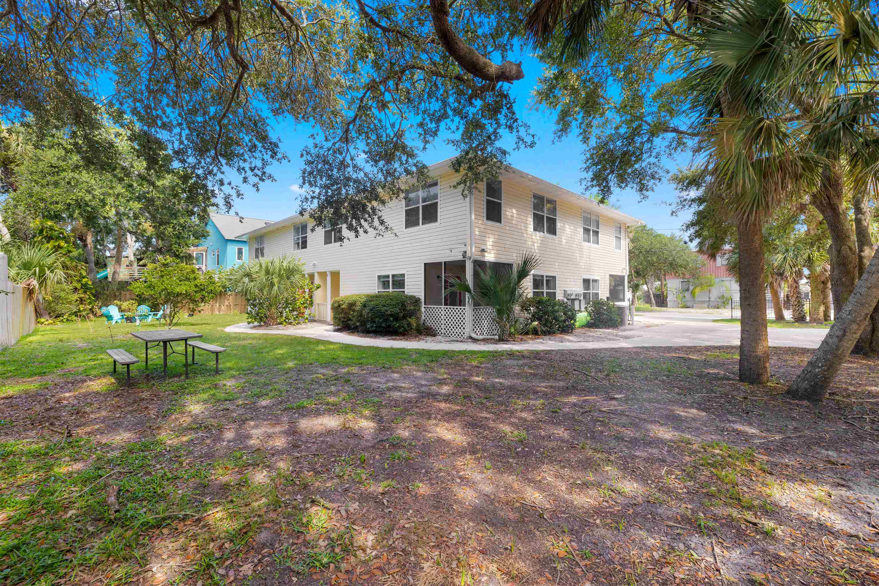 109 B Street, Unit D St. Augustine Beach, FL 32080 - Photo 22 of 29 a view of a house with a yard