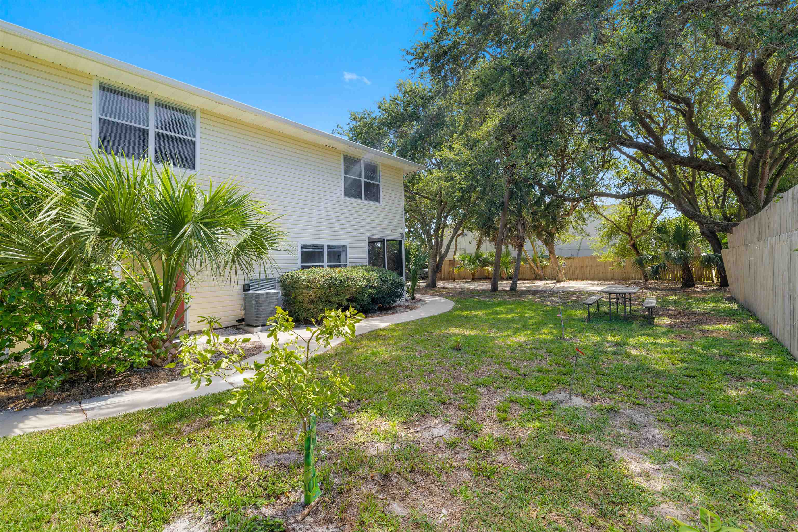 109 B Street, Unit D St. Augustine Beach, FL 32080 - Photo 23 of 29 a view of backyard of house with green space