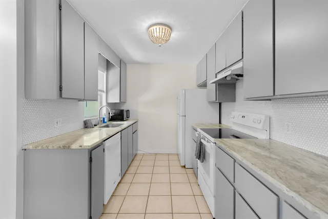 a room with a bed and cabinets