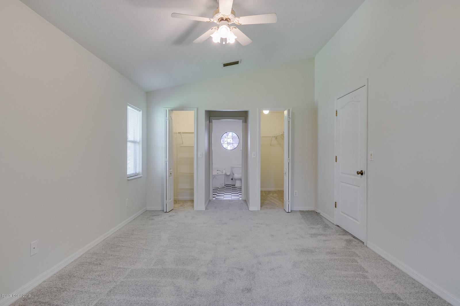 1336 Sapulpa Road Southwest Palm Bay, FL 32908 - Photo 13 of 25 an empty room with fan and entrance