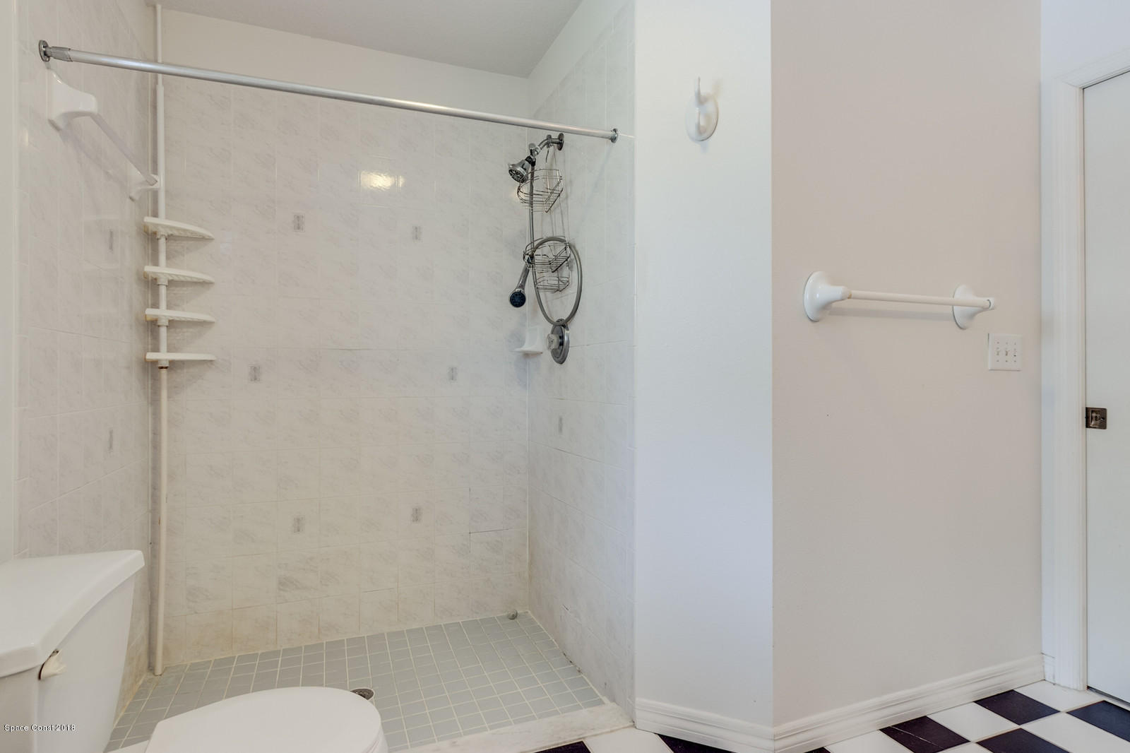 1336 Sapulpa Road Southwest Palm Bay, FL 32908 - Photo 14 of 25 a bathroom with a shower and toilet