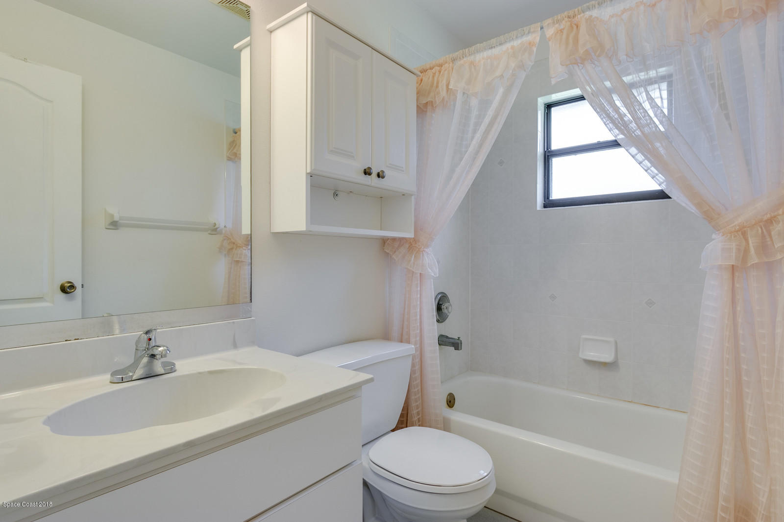 1336 Sapulpa Road Southwest Palm Bay, FL 32908 - Photo 17 of 25 a bathroom with a sink toilet and shower