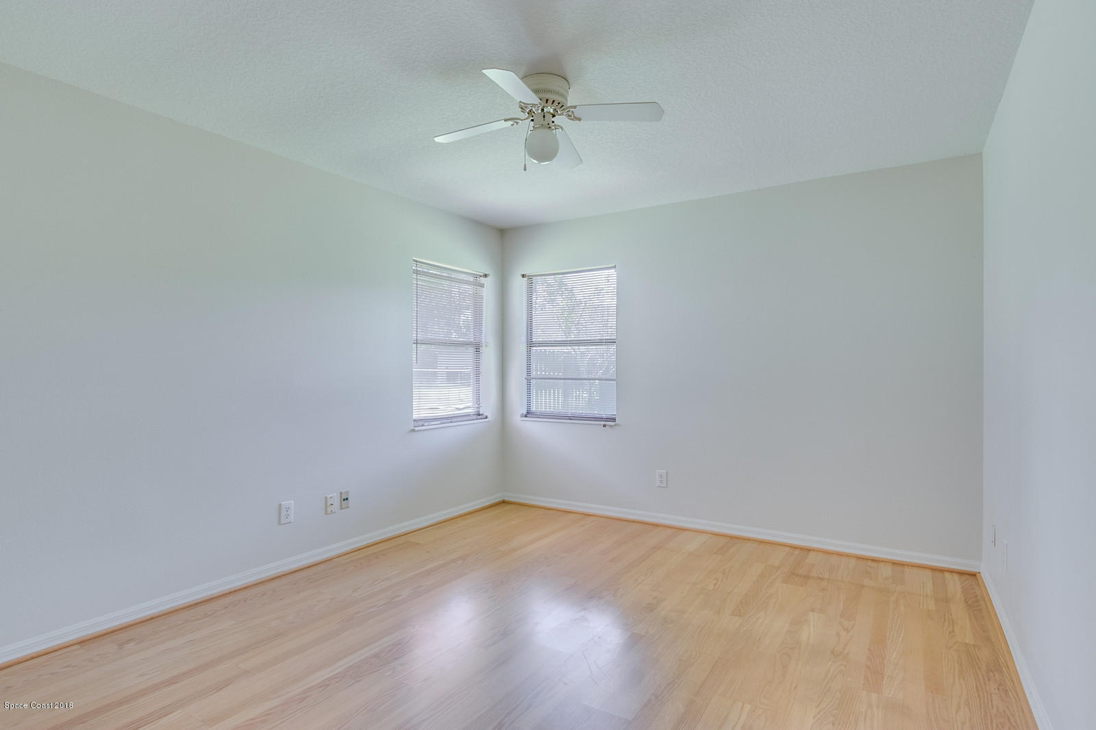 1336 Sapulpa Road Southwest Palm Bay, FL 32908 - Photo 18 of 25 wooden floor in an empty room with a window