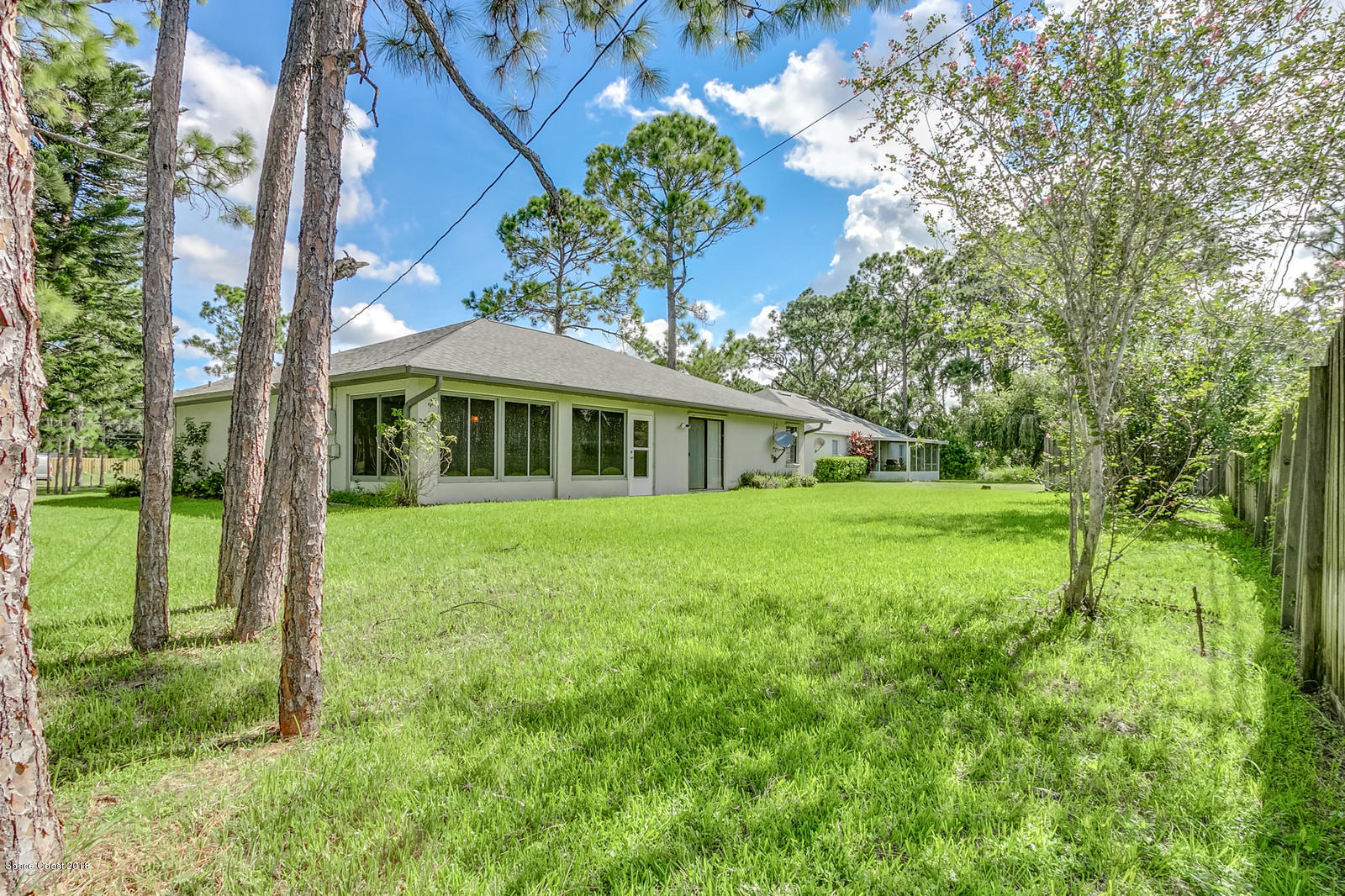 1336 Sapulpa Road Southwest Palm Bay, FL 32908 - Photo 21 of 25 a view of a house with a yard