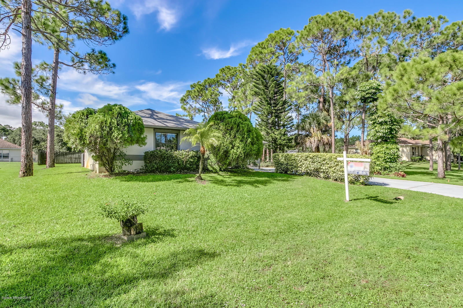 1336 Sapulpa Road Southwest Palm Bay, FL 32908 - Photo 25 of 25 a garden with lots of trees
