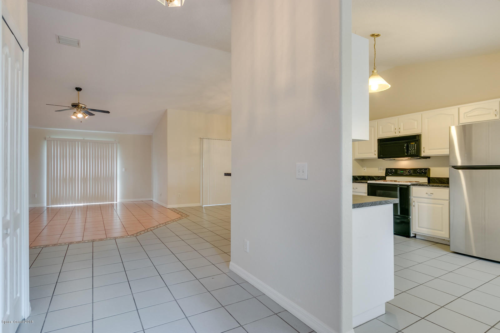 1336 Sapulpa Road Southwest Palm Bay, FL 32908 - Photo 4 of 25 a view of kitchen with sink refrigerator and window