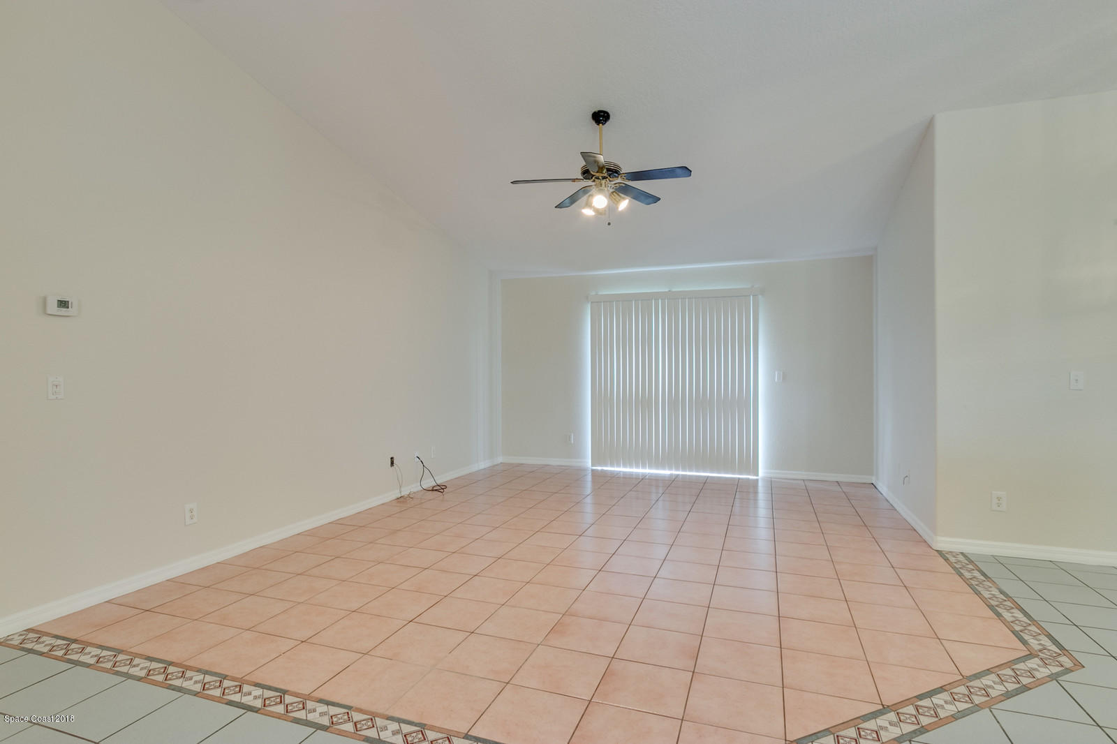 1336 Sapulpa Road Southwest Palm Bay, FL 32908 - Photo 6 of 25 a view of an empty room with a window