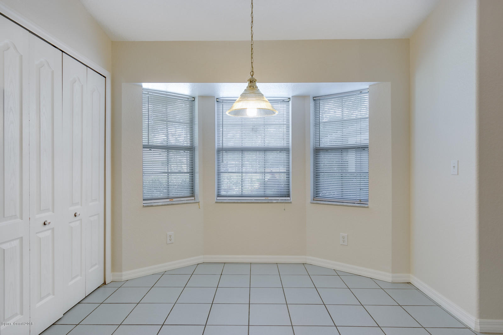 1336 Sapulpa Road Southwest Palm Bay, FL 32908 - Photo 8 of 25 a view of an empty room with a window