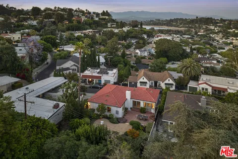 a aerial view of a house with a yard