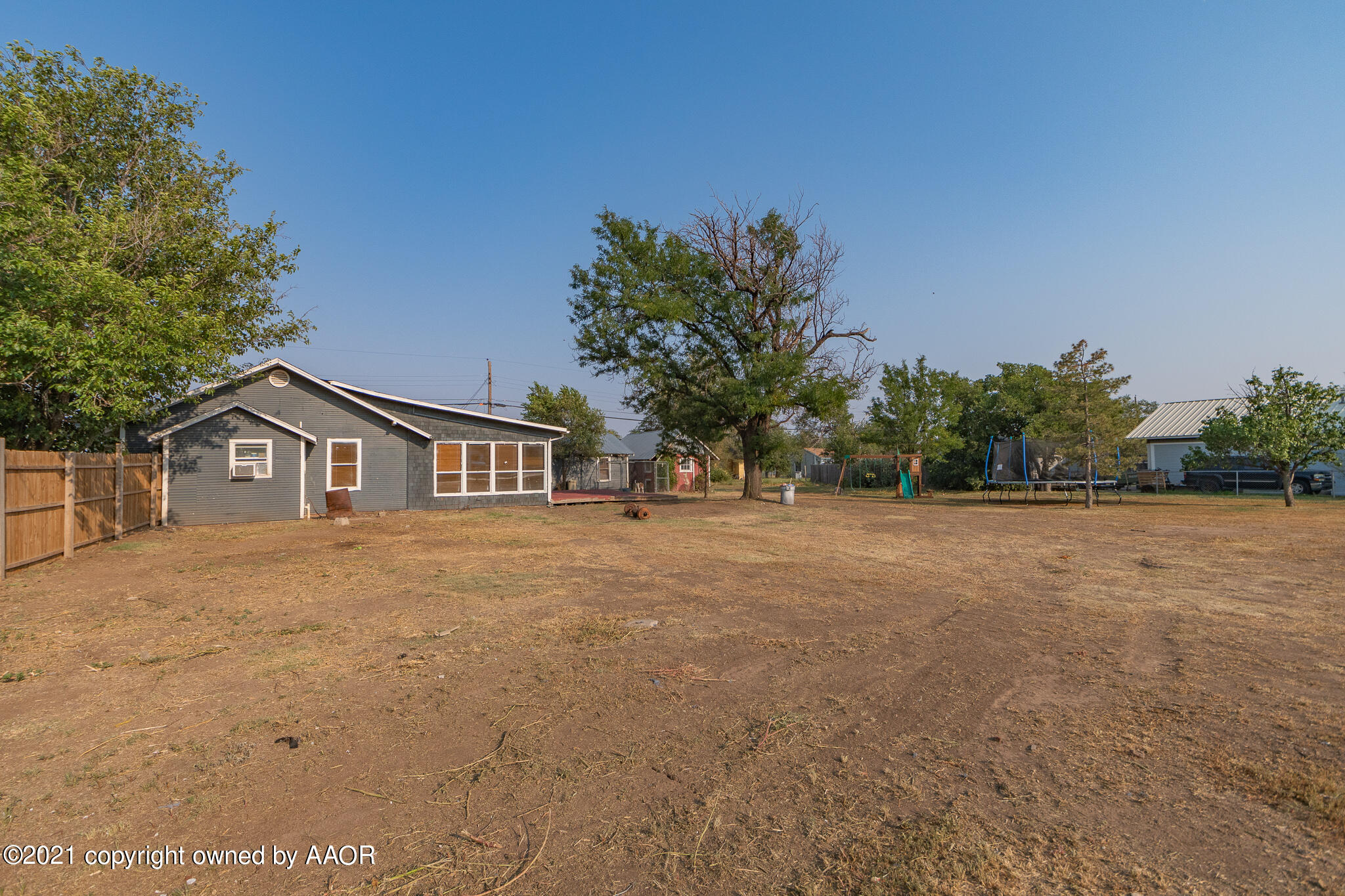 105 Southwest 41st Avenue Amarillo, TX 79110 - Photo 23 of 27 a front view of a house with a yard and trees