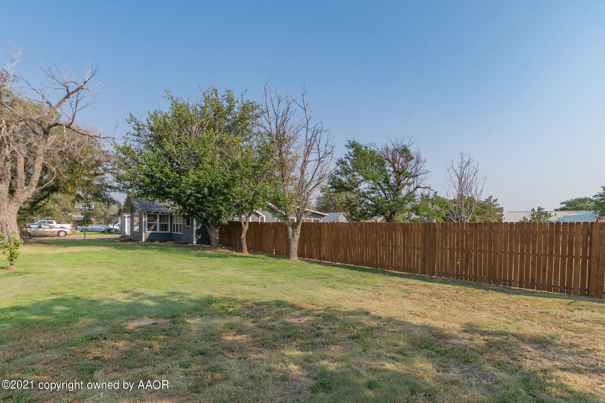 105 Southwest 41st Avenue Amarillo, TX 79110 - Photo 5 of 27 a swimming pool with wooden fence
