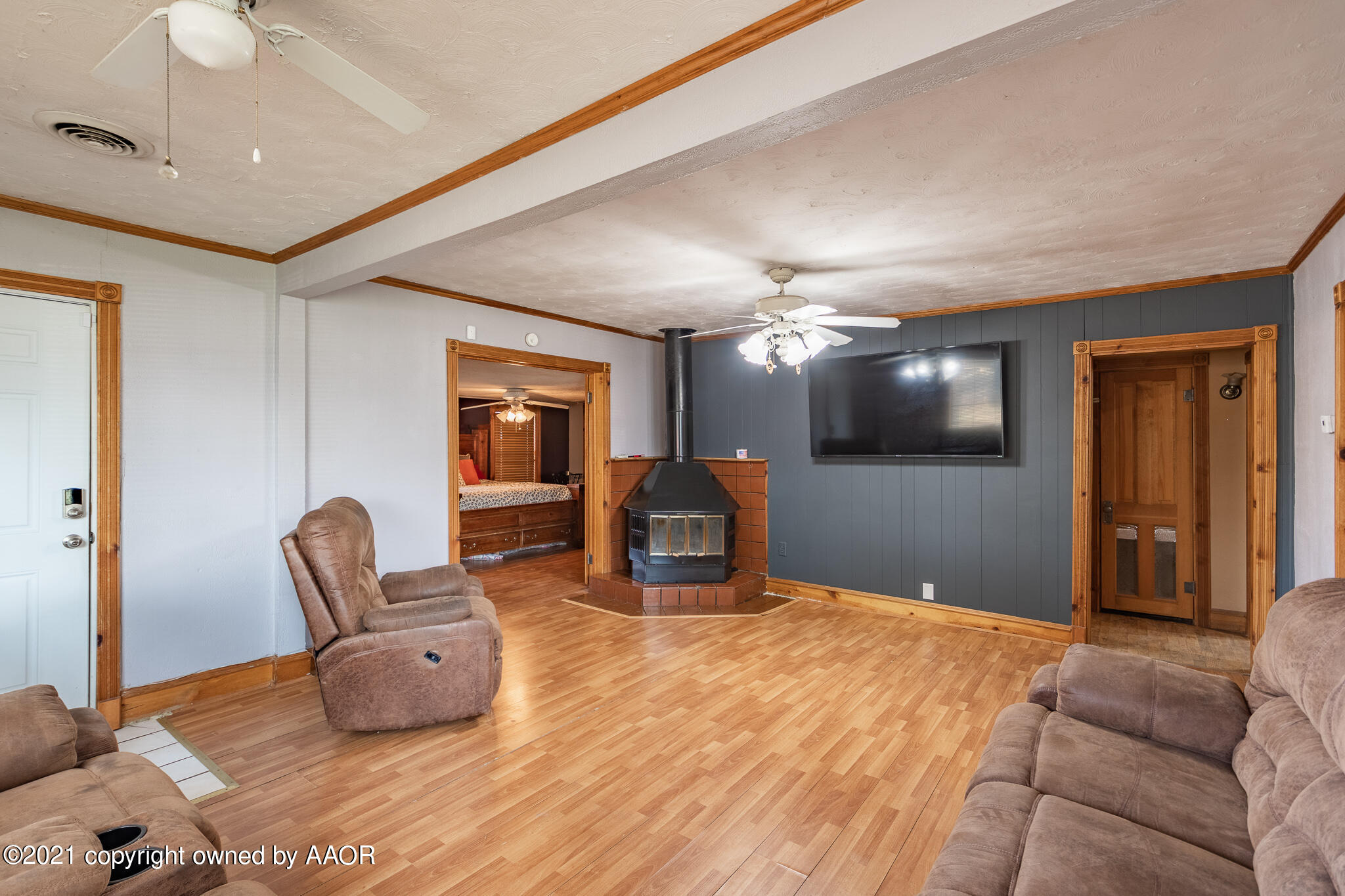 105 Southwest 41st Avenue Amarillo, TX 79110 - Photo 8 of 27 a bedroom with furniture and a flat screen tv