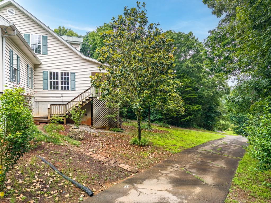 176 Big Oak Tree Road Northwest Adairsville, GA 30103 - Photo 6 of 77 a view of a house with a yard