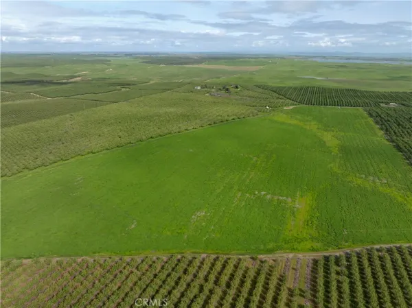 a view of a field with an outdoor space