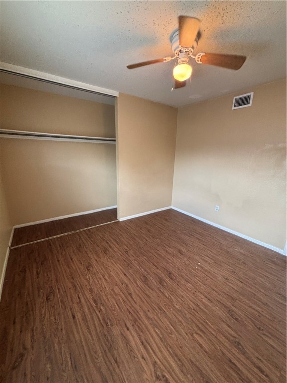 2119 Westwind Circle, Unit 2 Ingleside, TX 78362 - Photo 12 of 16 a view of an empty room with wooden floor and a window