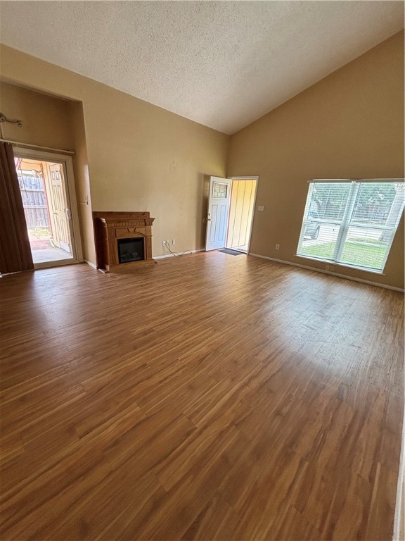 2119 Westwind Circle, Unit 2 Ingleside, TX 78362 - Photo 5 of 16 a view of empty room with wooden floor and fireplace