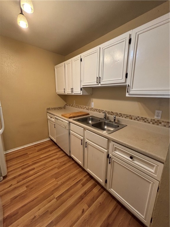 2119 Westwind Circle, Unit 2 Ingleside, TX 78362 - Photo 7 of 16 a kitchen with granite countertop white cabinets and white appliances