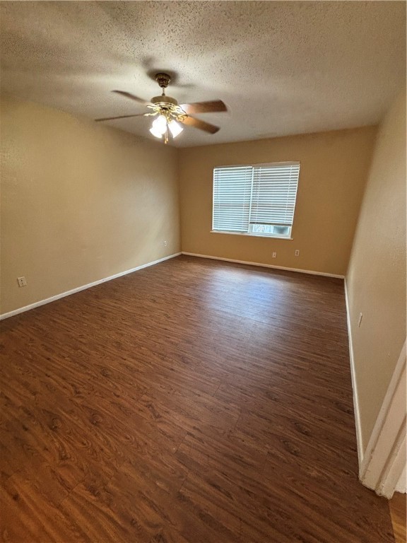 2119 Westwind Circle, Unit 2 Ingleside, TX 78362 - Photo 9 of 16 a view of an empty room with wooden floor and a window