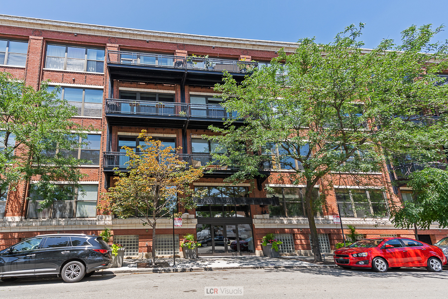1040 West Adams Street, Unit 247 Chicago, IL 60607 - Photo 1 of 20 a car parked in front of a building