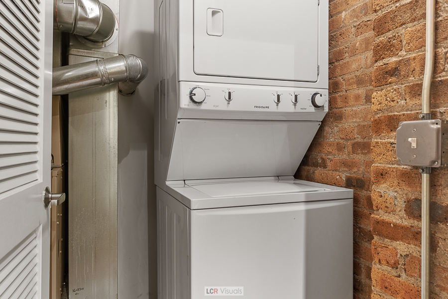 1040 West Adams Street, Unit 247 Chicago, IL 60607 - Photo 15 of 20 a utility room with dryer and washer