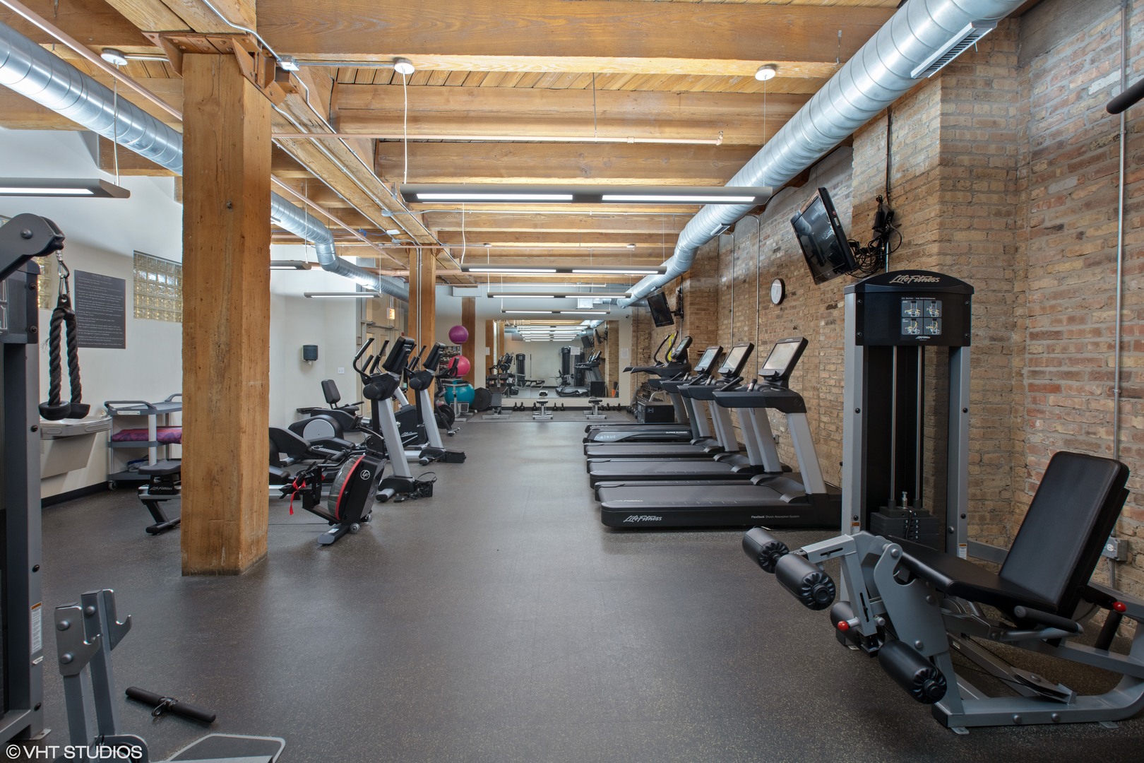1040 West Adams Street, Unit 247 Chicago, IL 60607 - Photo 20 of 20 a view of a room with gym equipment