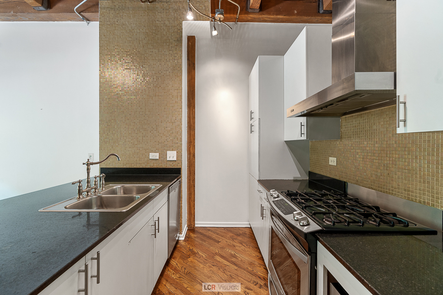 1040 West Adams Street, Unit 247 Chicago, IL 60607 - Photo 10 of 20 a kitchen that has a sink and a stove