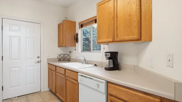 a kitchen with a stove and a white cabinet