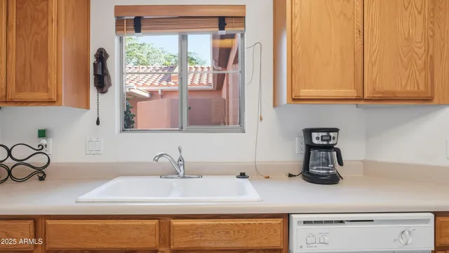 a view of a dining room with furniture wooden floor and a chandelier