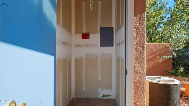 a backyard of a house with table and chairs