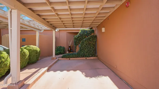 a front view of a house with outdoor seating