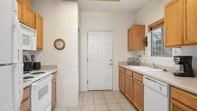 a kitchen with a stove and a microwave