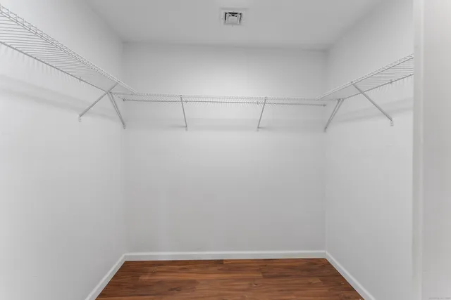 a bathroom with a double vanity sink and mirror