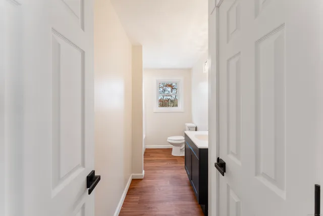a bathroom with a toilet and a bathtub