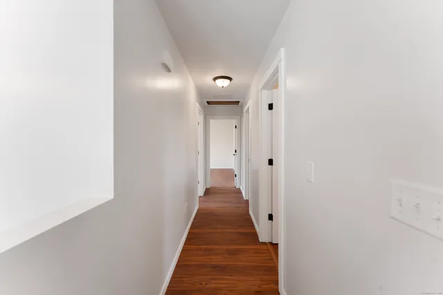 a view of a hallway with front door
