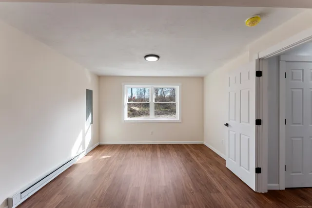 a view of balcony with wooden floor