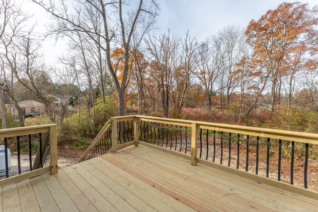 a view of a house with a yard and covered with snow