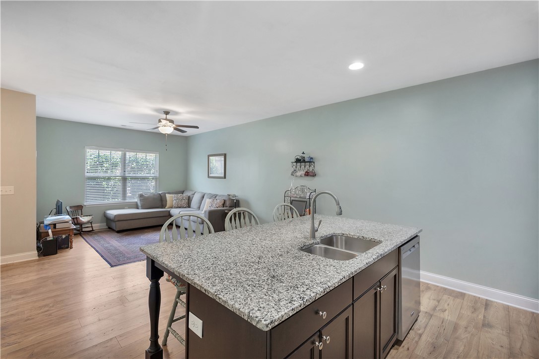 121 Ventura Street Anderson, SC 29621 - Photo 31 of 32 An open floorplan seamlessly connects the kitchen island to a spacious living area, ideal for gathering.