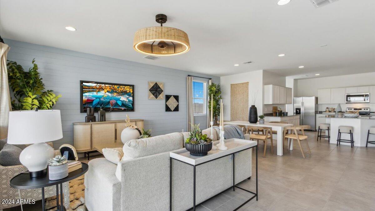 1126 South Mulberry Street Florence, AZ 85132 - Photo 11 of 21 a living room with furniture and a flat screen tv