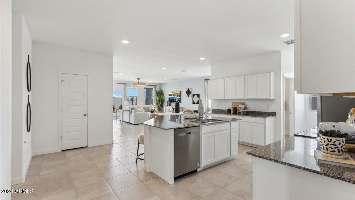 1126 South Mulberry Street Florence, AZ 85132 - Photo 5 of 21 a kitchen with stainless steel appliances a sink stove and refrigerator