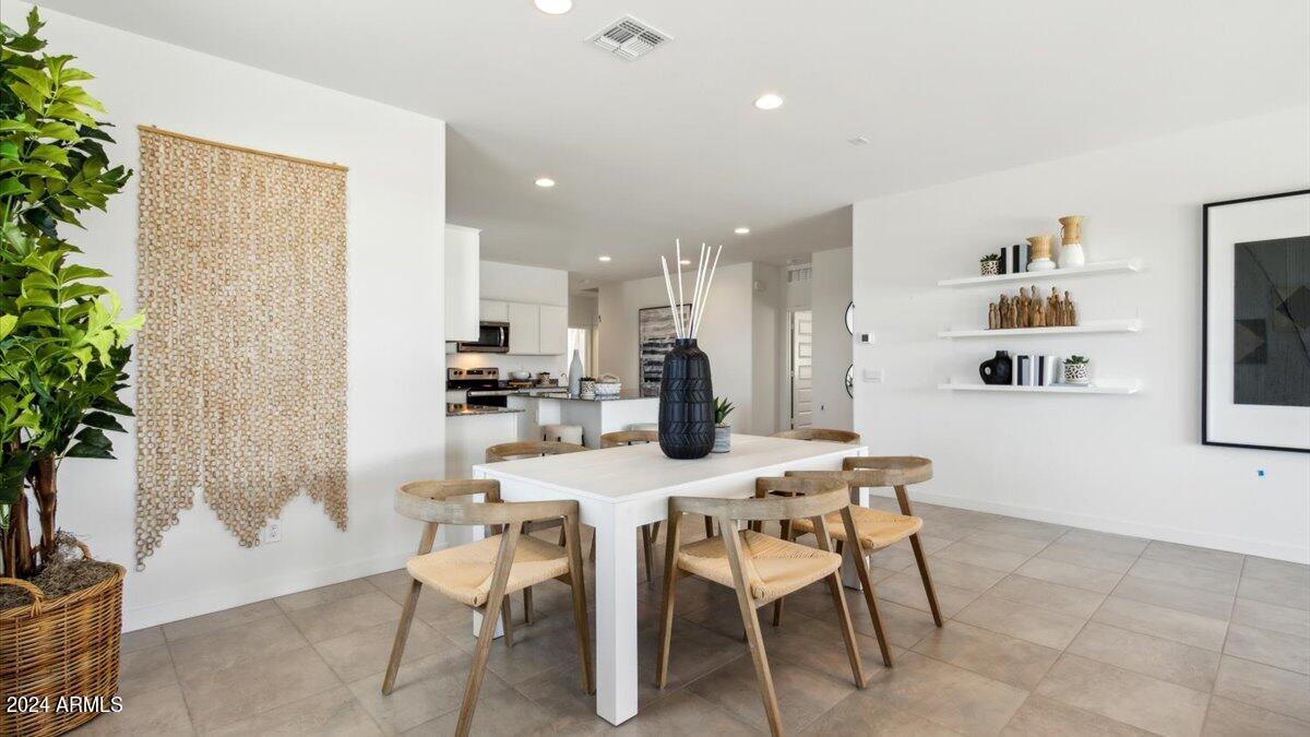 1126 South Mulberry Street Florence, AZ 85132 - Photo 7 of 21 a dining room with furniture and kitchen view