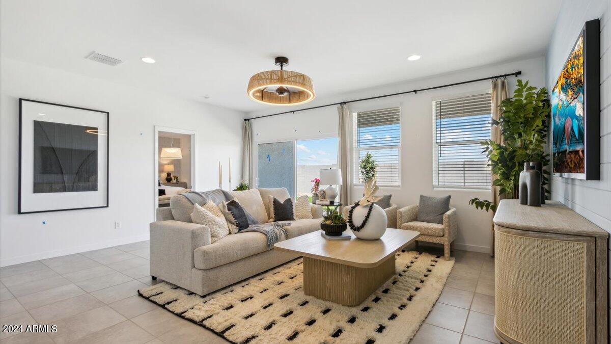 1126 South Mulberry Street Florence, AZ 85132 - Photo 10 of 21 a living room with furniture potted plant and a large window