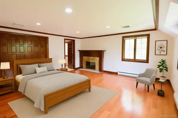 a bedroom with a bed and a large window