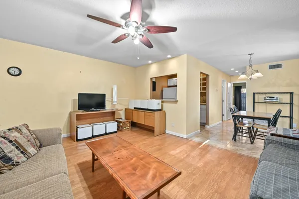 a bedroom with furniture and a flat screen tv