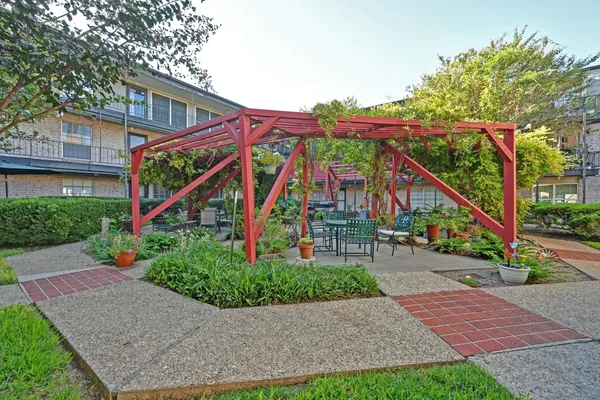 a view of a chairs and table in a patio