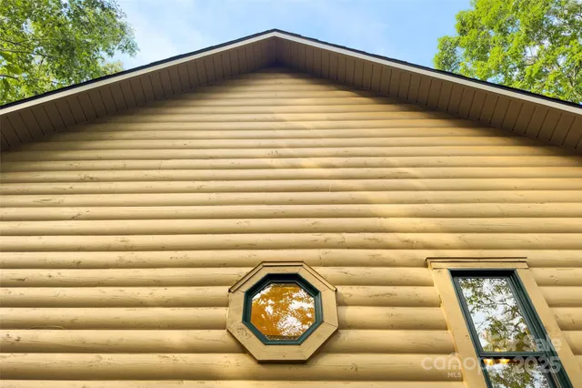 a view of a room with a wooden floor and a large window